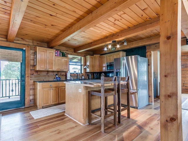 15701 S Pennsylvania Ave, Oklahoma City, OK 73170 - kitchen with stainless steel appliances, a wooden ceiling with exposed beams, light wood-style floors, a kitchen breakfast bar, and a center island