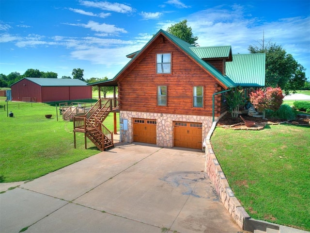 15701 S Pennsylvania Ave, Oklahoma City, OK 73170 - view of home's exterior featuring a garage, a lawn, stone siding, stairs, and concrete driveway