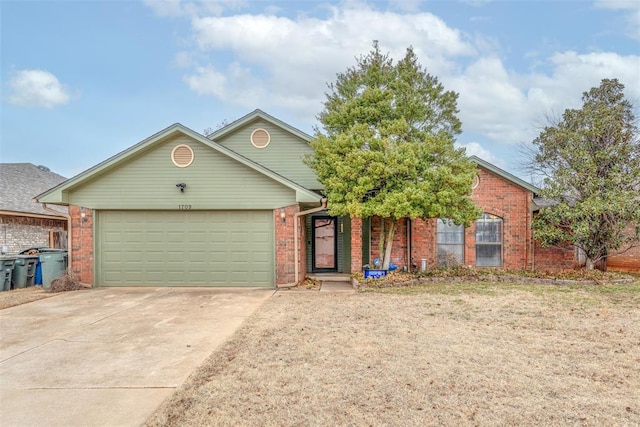 1709 Rocky Mountain Way, Edmond, OK 73003 - view of front of property featuring brick siding, concrete driveway, and an attached garage