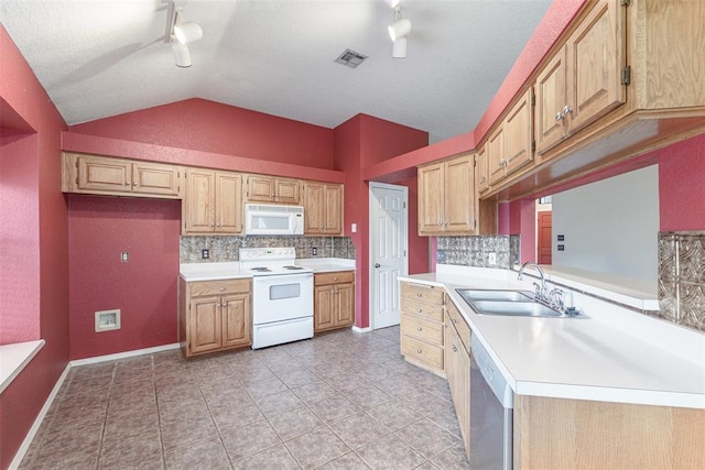 1709 Rocky Mountain Way, Edmond, OK 73003 - kitchen featuring white appliances, rail lighting, backsplash, lofted ceiling, and light countertops