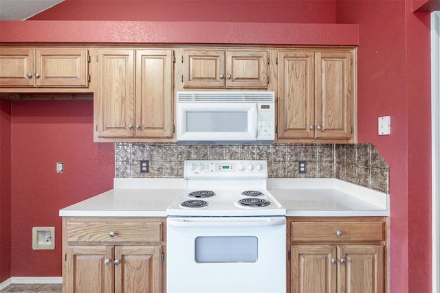 1709 Rocky Mountain Way, Edmond, OK 73003 - kitchen featuring white appliances, tasteful backsplash, light countertops, and a textured wall