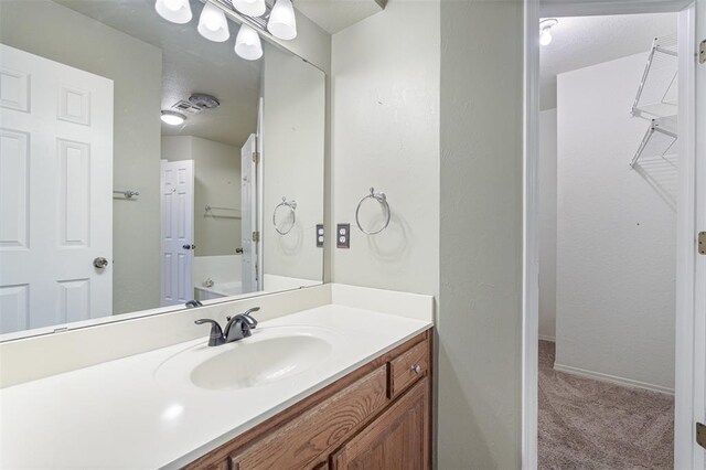 1709 Rocky Mountain Way, Edmond, OK 73003 - bathroom with vanity and baseboards