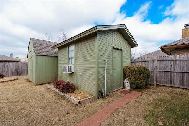 1709 Rocky Mountain Way, Edmond, OK 73003 - view of shed with a fenced backyard and cooling unit