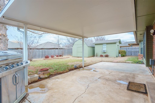 1709 Rocky Mountain Way, Edmond, OK 73003 - fenced backyard featuring a storage shed and a patio