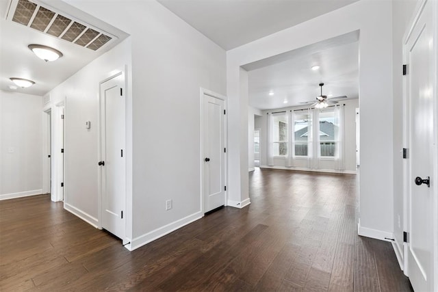 808 Scully Rd, Yukon, OK 73099 - corridor with dark wood-type flooring and baseboards