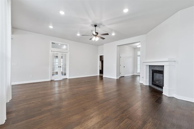 808 Scully Rd, Yukon, OK 73099 - unfurnished living room featuring dark wood-style floors, a ceiling fan, a glass covered fireplace, french doors, and recessed lighting