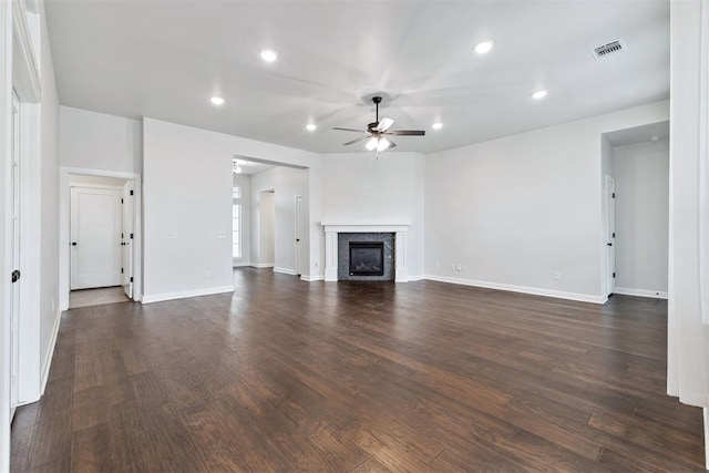 808 Scully Rd, Yukon, OK 73099 - unfurnished living room featuring a ceiling fan, dark wood-type flooring, recessed lighting, and a glass covered fireplace