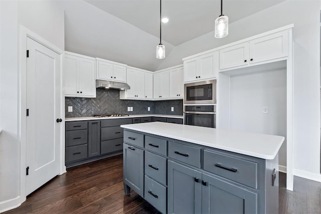 808 Scully Rd, Yukon, OK 73099 - kitchen with oven, gray cabinetry, black microwave, lofted ceiling, and dark wood finished floors