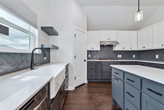 808 Scully Rd, Yukon, OK 73099 - kitchen featuring open shelves, under cabinet range hood, vaulted ceiling, gray cabinetry, and tasteful backsplash