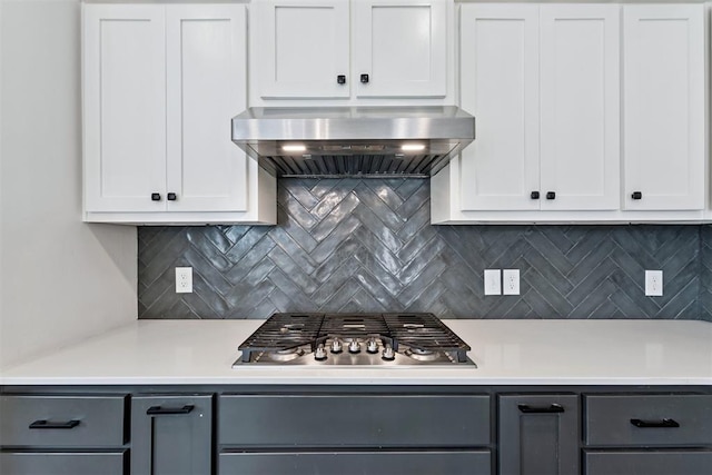 808 Scully Rd, Yukon, OK 73099 - kitchen featuring stainless steel gas cooktop, exhaust hood, light countertops, and backsplash
