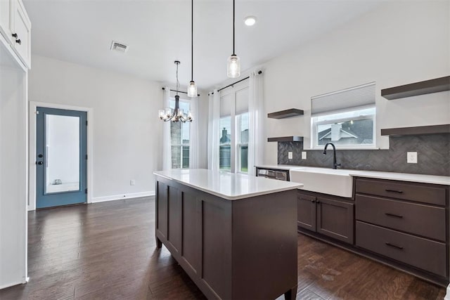 808 Scully Rd, Yukon, OK 73099 - kitchen with open shelves, a chandelier, light countertops, decorative backsplash, and recessed lighting