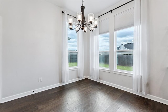 808 Scully Rd, Yukon, OK 73099 - unfurnished dining area featuring a chandelier, dark wood-style flooring, and plenty of natural light