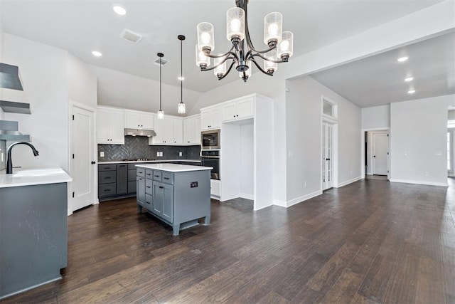 808 Scully Rd, Yukon, OK 73099 - kitchen featuring appliances with stainless steel finishes, under cabinet range hood, a chandelier, recessed lighting, and gray cabinets