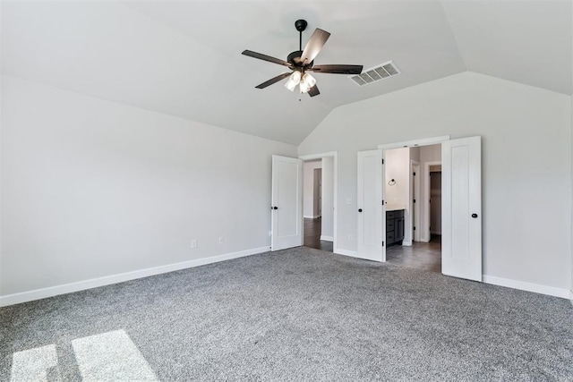808 Scully Rd, Yukon, OK 73099 - unfurnished bedroom featuring dark carpet, lofted ceiling, ceiling fan, and connected bathroom