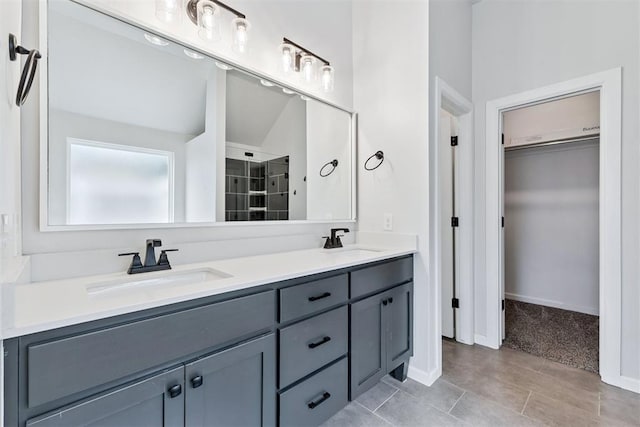 808 Scully Rd, Yukon, OK 73099 - full bath with double vanity, a spacious closet, and tile patterned flooring