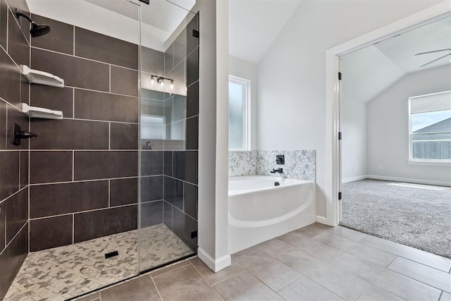 808 Scully Rd, Yukon, OK 73099 - full bathroom with lofted ceiling, a bath, tiled shower, and tile patterned flooring