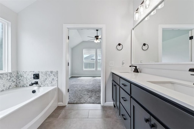 808 Scully Rd, Yukon, OK 73099 - full bath featuring vaulted ceiling, a ceiling fan, double vanity, a garden tub, and tile patterned flooring