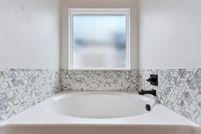 808 Scully Rd, Yukon, OK 73099 - full bathroom featuring healthy amount of natural light, a garden tub, and tile walls