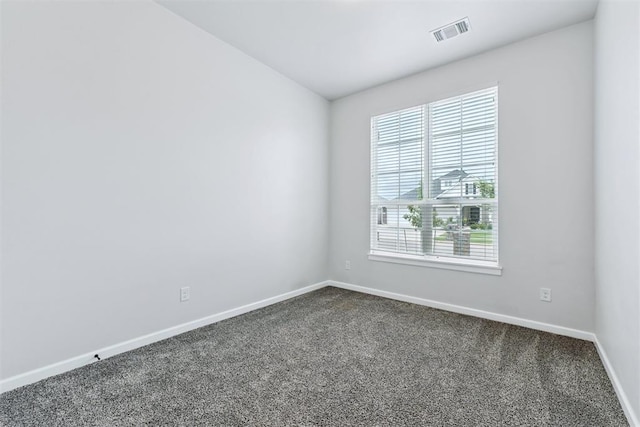 808 Scully Rd, Yukon, OK 73099 - spare room with dark carpet and baseboards
