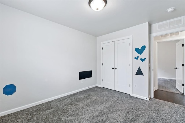 808 Scully Rd, Yukon, OK 73099 - unfurnished bedroom featuring dark carpet and a closet