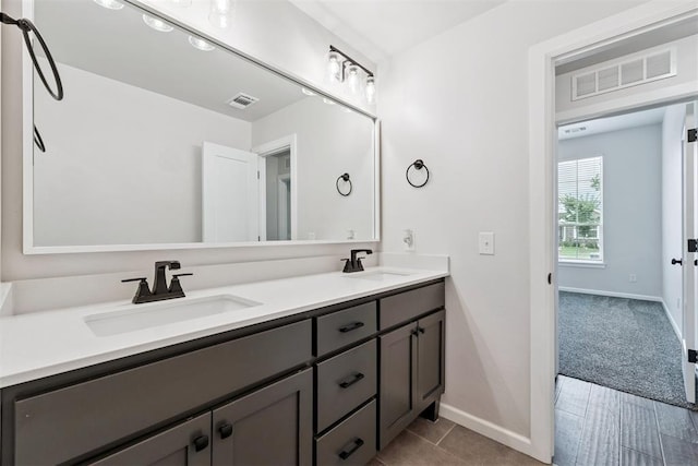 808 Scully Rd, Yukon, OK 73099 - bathroom featuring double vanity and tile patterned flooring