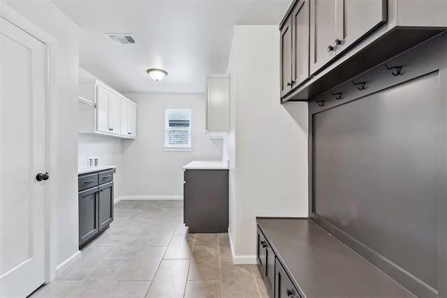 808 Scully Rd, Yukon, OK 73099 - mudroom with baseboards and light tile patterned floors