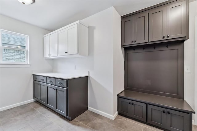 808 Scully Rd, Yukon, OK 73099 - mudroom featuring baseboards and light tile patterned floors