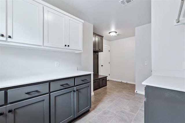 808 Scully Rd, Yukon, OK 73099 - kitchen featuring gray cabinetry, light countertops, white cabinets, and light tile patterned floors