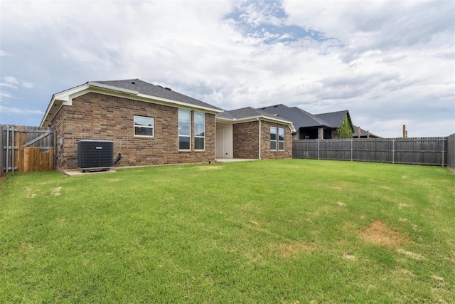 808 Scully Rd, Yukon, OK 73099 - rear view of house with a fenced backyard and brick siding
