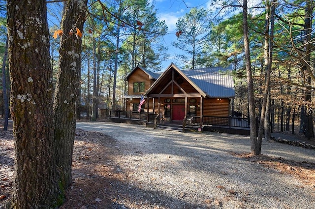 123 Hemlock Grove Rd, Hochatown, OK 74728 - chalet / cabin featuring log veneer siding and a metal roof