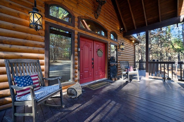 123 Hemlock Grove Rd, Hochatown, OK 74728 - view of exterior entry featuring log veneer siding and covered porch