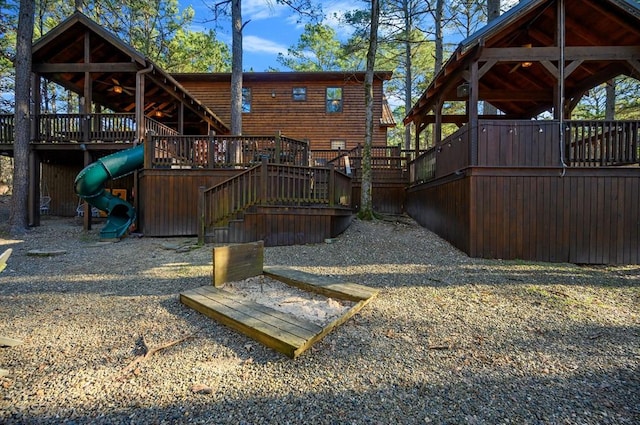 123 Hemlock Grove Rd, Hochatown, OK 74728 - back of house with stairs and a deck