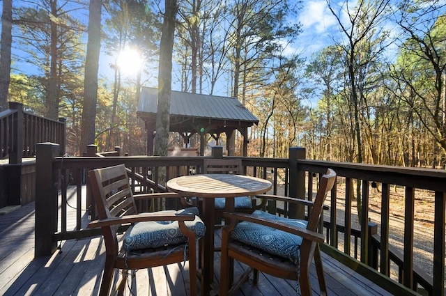 123 Hemlock Grove Rd, Hochatown, OK 74728 - deck featuring outdoor dining area