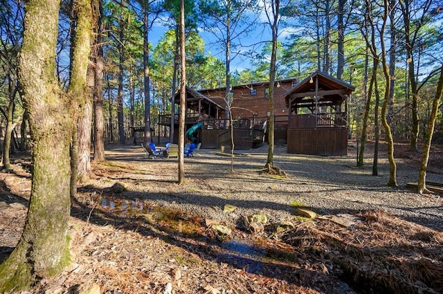123 Hemlock Grove Rd, Hochatown, OK 74728 - view of yard with a deck