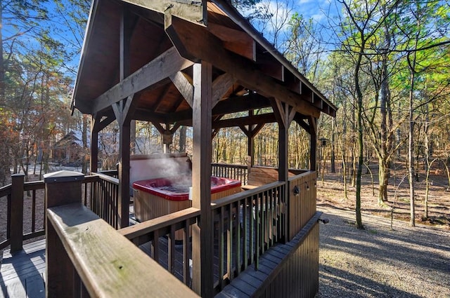123 Hemlock Grove Rd, Hochatown, OK 74728 - wooden deck featuring a hot tub and a gazebo
