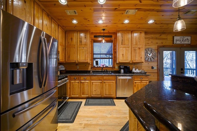 123 Hemlock Grove Rd, Hochatown, OK 74728 - kitchen featuring appliances with stainless steel finishes, light wood-style flooring, french doors, recessed lighting, and pendant lighting