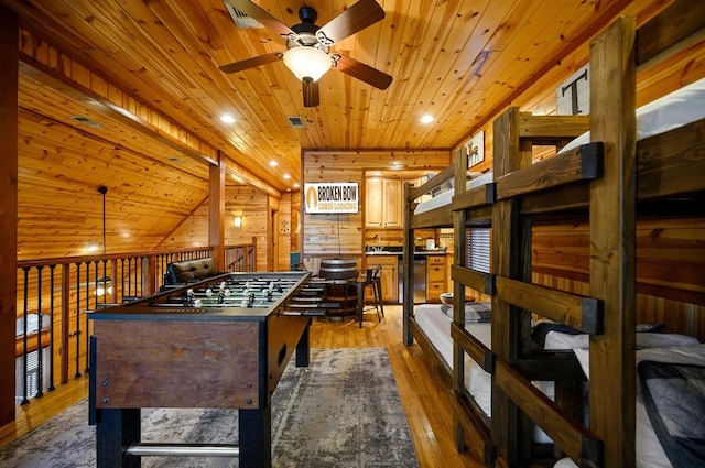 123 Hemlock Grove Rd, Hochatown, OK 74728 - rec room with a ceiling fan, wooden ceiling, light wood-type flooring, recessed lighting, and wood walls