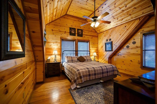 123 Hemlock Grove Rd, Hochatown, OK 74728 - bedroom with wooden ceiling, vaulted ceiling, wooden walls, and hardwood / wood-style floors