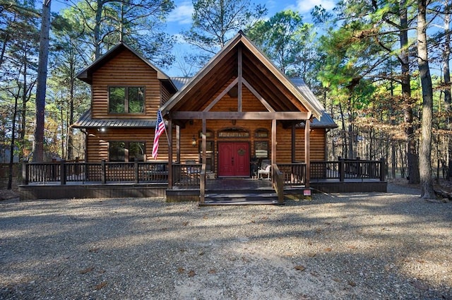 123 Hemlock Grove Rd, Hochatown, OK 74728 - rustic home with log veneer siding and a metal roof