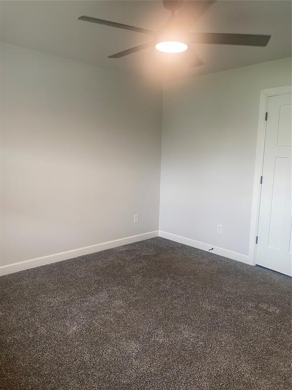 12616 NW 4th St, Yukon, OK 73099 - unfurnished room featuring baseboards and ceiling fan