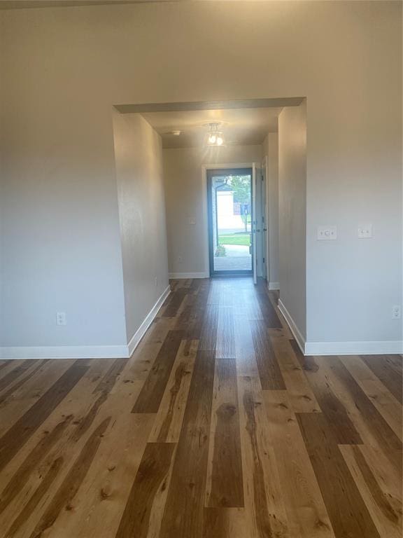 12616 NW 4th St, Yukon, OK 73099 - hallway featuring baseboards and dark wood finished floors