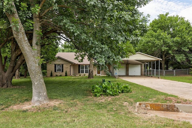 13229 Blue Quail Rd, Yukon, OK 73099 - ranch-style house with a garage, driveway, brick siding, and a carport