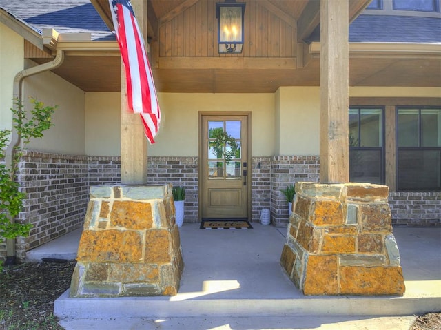 7308 Sunset Sail Ave, Edmond, OK 73034 - entrance to property with stucco siding, brick siding, stone siding, and a patio