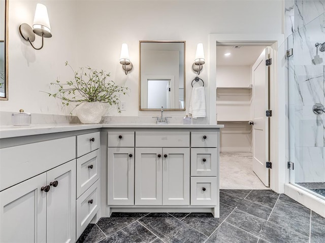 7308 Sunset Sail Ave, Edmond, OK 73034 - full bathroom with a marble finish shower, marble finish flooring, vanity, and a walk in closet