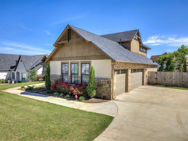 7308 Sunset Sail Ave, Edmond, OK 73034 - view of front of home with a garage, driveway, stone siding, and a shingled roof