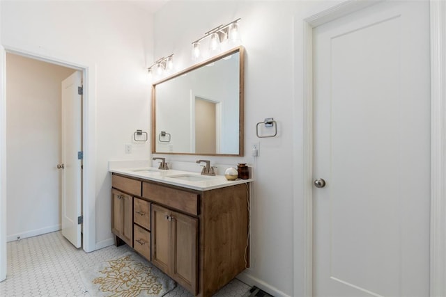 15921 Bison Dr, Moore, OK 73170 - full bathroom with double vanity and baseboards