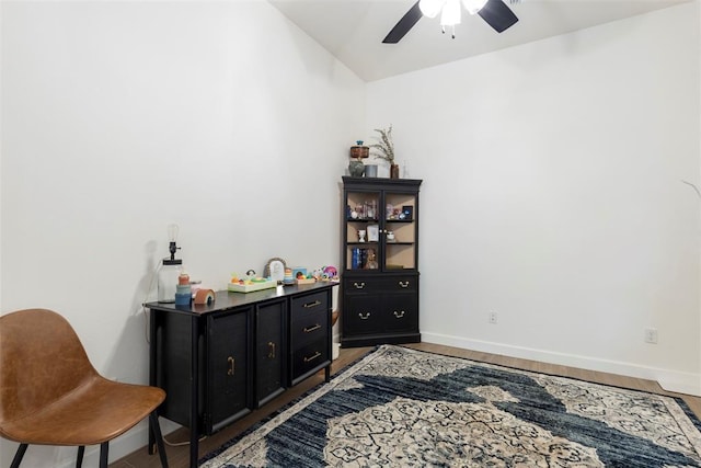15921 Bison Dr, Moore, OK 73170 - sitting room with a ceiling fan and wood finished floors