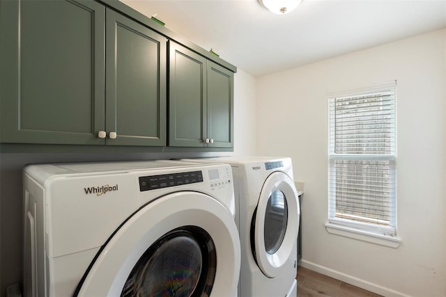 15921 Bison Dr, Moore, OK 73170 - washroom featuring cabinet space, washing machine and dryer, and light wood-type flooring
