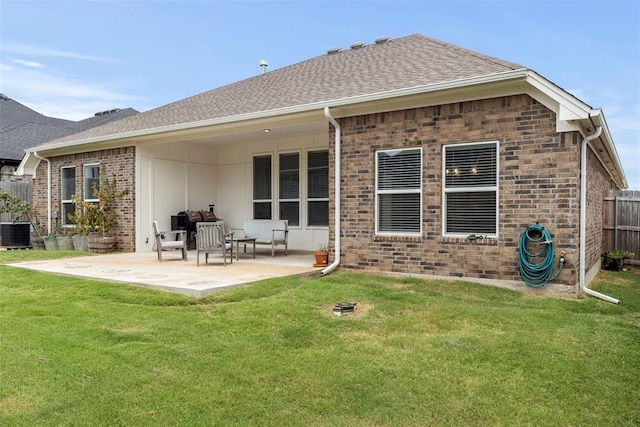 15921 Bison Dr, Moore, OK 73170 - rear view of house with brick siding, a patio area, and roof with shingles