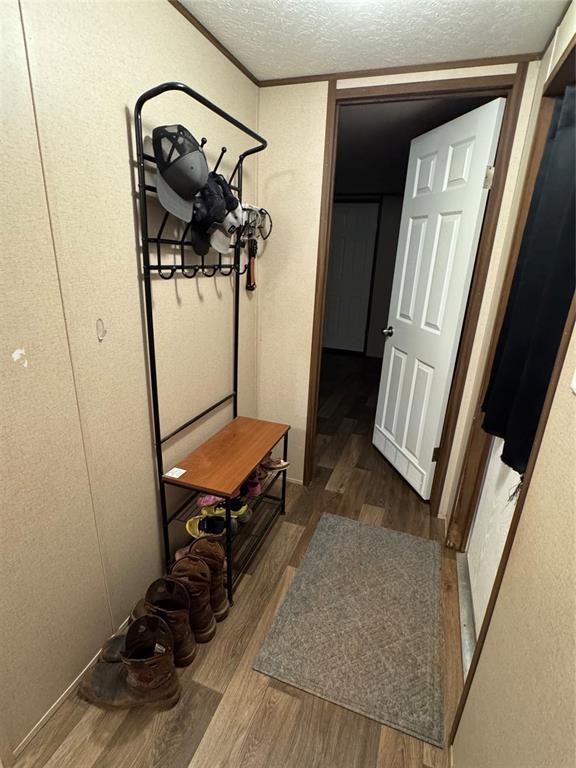 330633 E 875th Rd, Wellston, OK 74881 - mudroom with wood finished floors and a textured ceiling